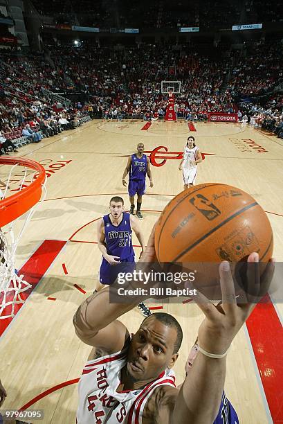 Chuck Hayes of the Houston Rockets lays up a shot against the Sacramento Kings during the game on March 3, 2010 at the Toyota Center in Houston,...