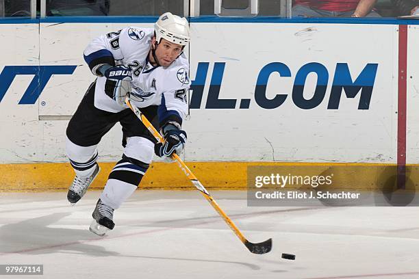Martin St. Louis of the Tampa Bay Lightning passes the puck against the Florida Panthers at the BankAtlantic Center on March 21, 2010 in Sunrise,...