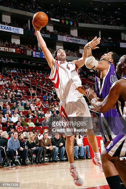Luis Scola of the Houston Rockets shoots against Sean May of the Sacramento Kings during the game on March 3, 2010 at the Toyota Center in Houston,...