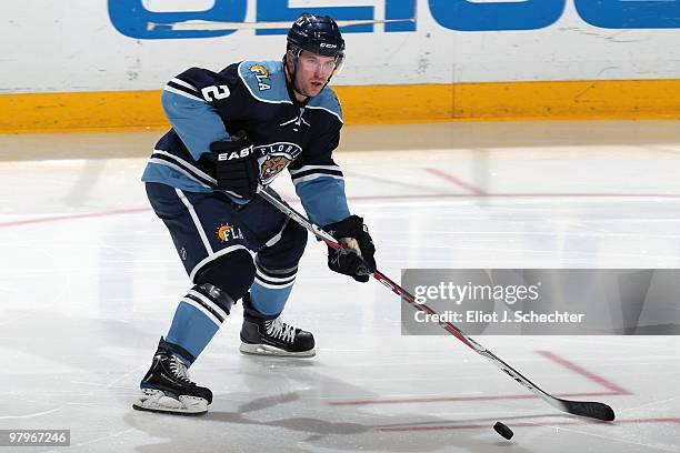 Keith Ballard of the Florida Panthers skates with the puck against the Tampa Bay Lightning at the BankAtlantic Center on March 21, 2010 in Sunrise,...