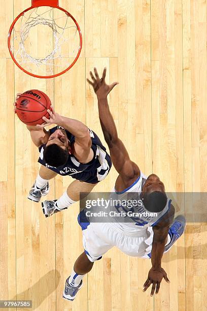 Adam Sollazzo of the East Tennessee State Buccaneers shoots the ball over Eric Bledsoe of the Kentucky Wildcats during the first round of the 2010...