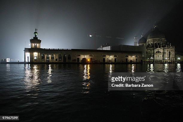 Punta della Dogana, see of the Francois Pinault Foundation contemporary art museum, is illuminated for nighttime filming of "The Tourist" on March...