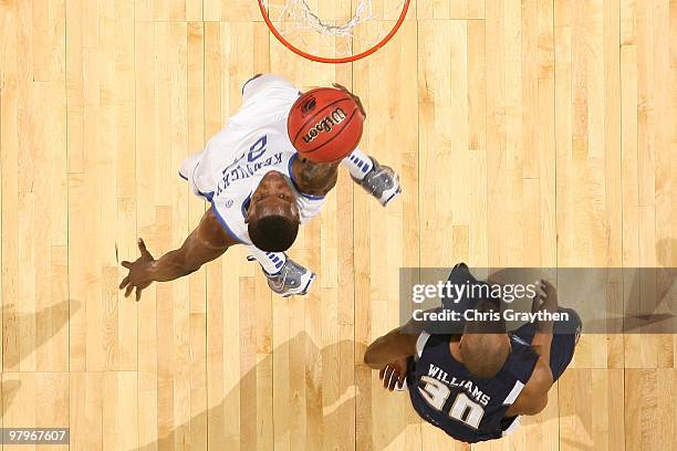Eric Bledsoe of the Kentucky Wildcats shoots the ball over Micah Williams of the East Tennessee State Buccaneers during the first round of the 2010...