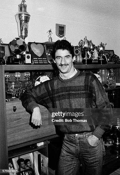 Ian Rush of Liverpool in front of his trophy cabinet at his home in Merseyside, Liverpool in January 1985.