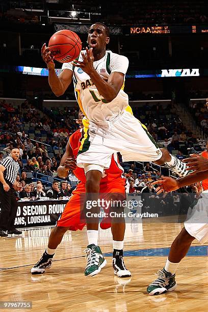 Ekpe Udoh of the Baylor Bears grabs a rebound against the Sam Houston State Bearkats during the first round of the 2010 NCAA men's basketball...