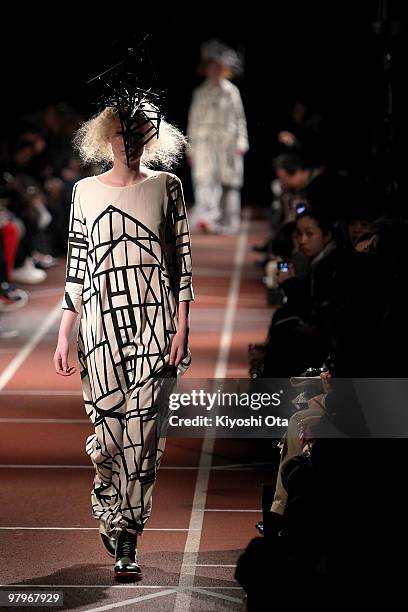 Model showcases the mintdesigns 2010-2011 Autumn/Winter Collection designed by Hokuto Katsui and Nao Yagi on the catwalk at the National Stadium on...