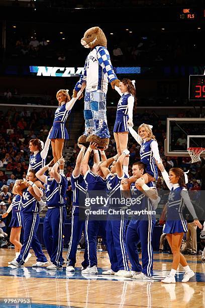 Cheerleaders of the Kentucky Wildcats perform with the mascot during the game against the East Tennessee State Buccaneers during the first round of...