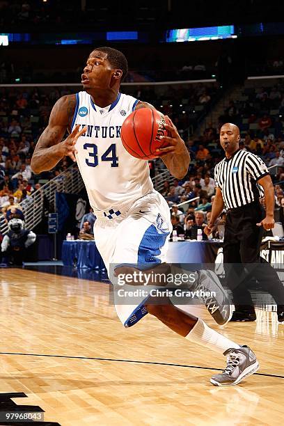 DeAndre Liggins of the Kentucky Wildcats drives the ball against the East Tennessee State Buccaneers during the first round of the 2010 NCAA men's...