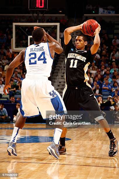 Harris of the Wake Forest Demon Deacons looks to pass the ball around Eric Bledsoe of the Kentucky Wildcats during the second round of the 2010 NCAA...