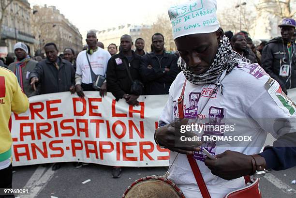 People demonstrate in support of illegal workers on March 23, 2010 in Paris, as part of a nationwide day of protest against job cuts, wages, the high...