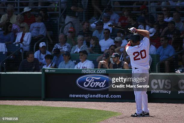 Kevin Youkilis of the Boston Red Sox waits to bat against the Baltimore Orioles on March 20, 2010 in Fort Myers, Florida.