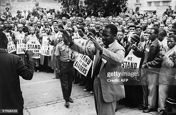 Supporters pray in front of the courthouse of Johannesburg, 28 December 1956, to support 152 anti-apartheid militants, in which Nelson Mandela,...