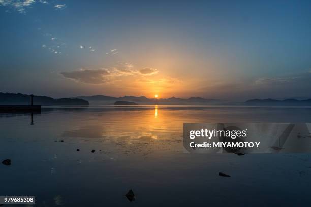 sunrise over sea, nagasaki, japan - miyamoto y stock-fotos und bilder