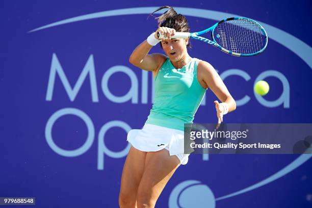 Lara Arruabarrena of Spain returns a shot against Samantha Stosur of Australia during day third of the Mallorca Open at Country Club Santa Ponsa on...