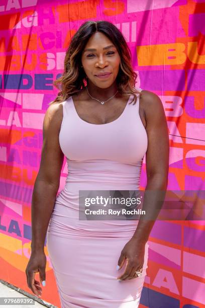 Serena Williams stands next to Isabel Castillo Guijarro's mural during the Allstate Foundation Purple Purse and Serena Williams' launch of a national...