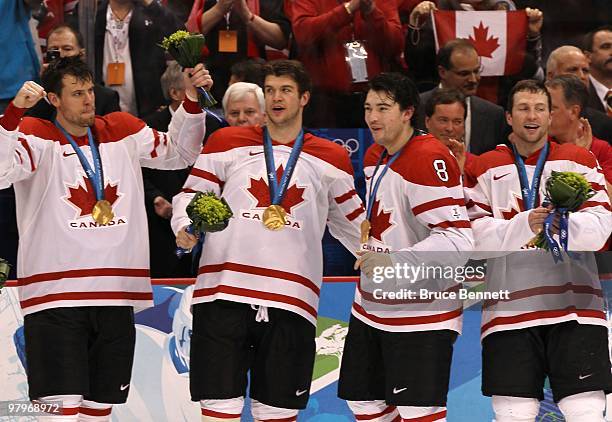 Shea Weber, Brent Seabrook, Drew Doughty and Brenden Morrow of Canada celebrate after the ice hockey men's gold medal game between USA and Canada on...