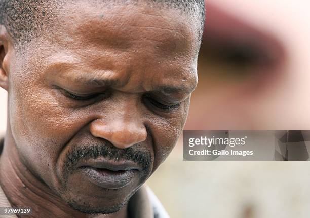 Eddie Masemelo, father of deceased Phomelelo grieves at his home on March 9, 2010 in Soweto, Johannesburg, South Africa. Phomelelo was one of the...
