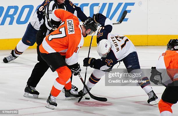Jeff Carter of the Philadelphia Flyers battles for the puck on a face-off against Todd White of the Atlanta Thrashers on March 21, 2010 at the...