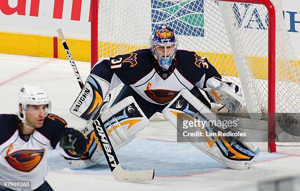 Ondrej Pavelec of the Atlanta Thrashers readies to stop a shot on goal by a member of the Philadelphia Flyers on March 21, 2010 at the Wachovia...