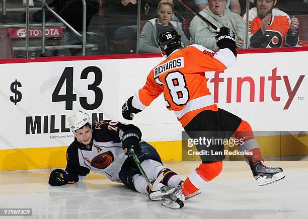 Mike Richards of the Philadelphia Flyers upends Colby Armstrong of the Atlanta Thrashers on March 21, 2010 at the Wachovia Center in Philadelphia,...