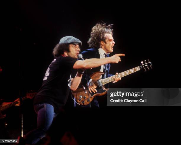 Brian Johnson and Angus Young from AC/DC perform live on stage at the Cow Palace in San Francisco on February 16, 1982