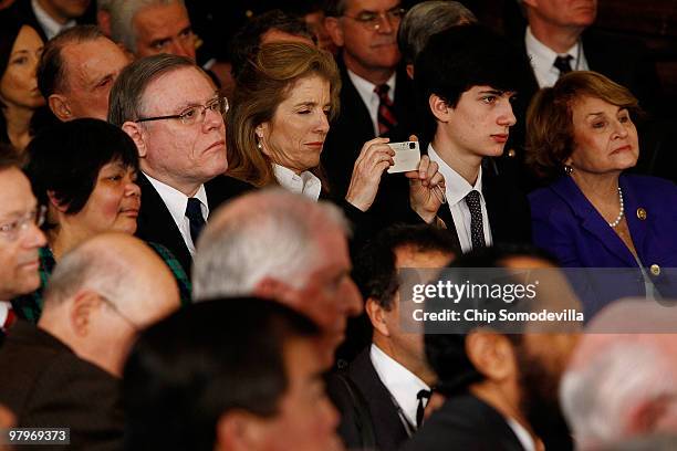 Caroline Kennedy , daughter of former President John F. Kennedy, takes photographs during the signing ceremony for the Affordable Health Care for...