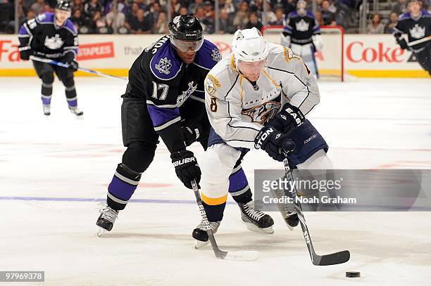 Kevin Klein of the Nashville Predators skates with the puck against Wayne Simmonds of the Los Angeles Kings on March 14, 2010 at Staples Center in...