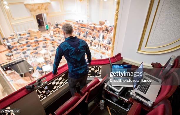 February 2018, Germany, Hamburg: Technician Alexandre Dietze wears a so-called 'Sound Shirt' before a concert of the Young Hamburg Symphony Orchestra...