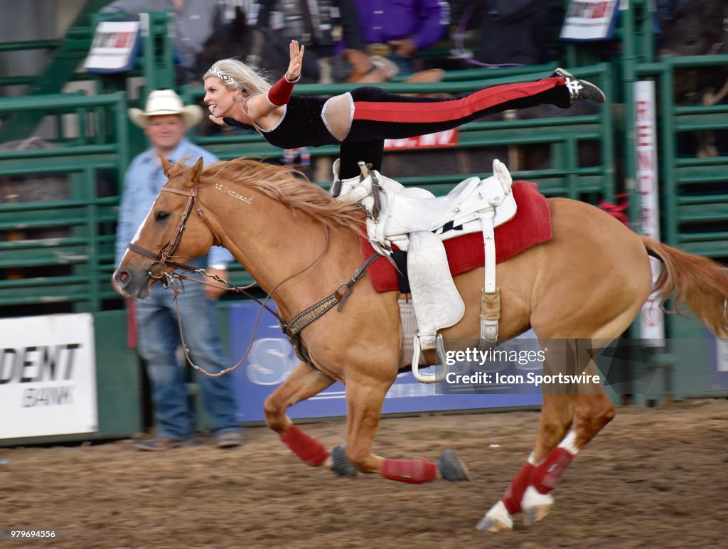 Jen Fisk Reno Rodeo Fans enjoy a trick riding demonstration by a member of the Riata ...