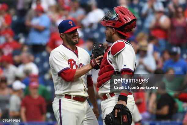 Philadelphia Phillies Pitcher Adam Morgan is congratulated by Philadelphia Phillies Catcher Jorge Alfaro during a Major League Baseball game between...