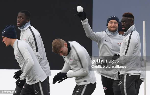 Dpatop - RB Leipzig's Konrad Laimer throws a snowball teammate Timo Werner during a training session ahead of Thursday's UEFA Europa League round of...