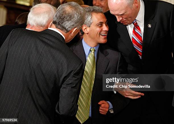 White House Chief of Staff Rahm Emanuel is congratulated by members of Congress after President Barack Obama signed the Affordable Health Care for...