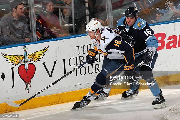 Henrik Tallinder of the Buffalo Sabres tangles with Nathan Horton of the Florida Panthers at the BankAtlantic Center on March 20, 2010 in Sunrise,...
