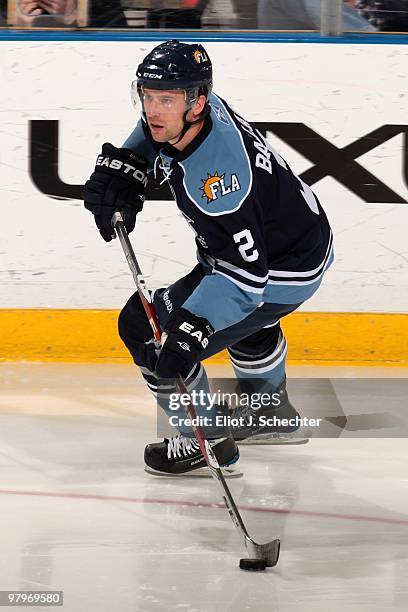 Keith Ballard of the Florida Panthers skates with the puck against the Buffalo Sabres at the BankAtlantic Center on March 20, 2010 in Sunrise,...