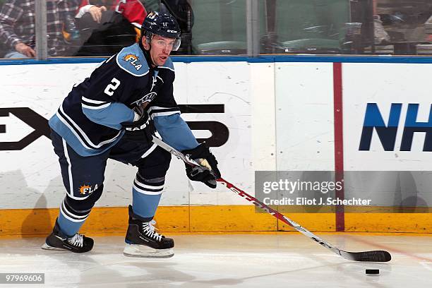 Keith Ballard of the Florida Panthers skates with the puck against the Buffalo Sabres at the BankAtlantic Center on March 20, 2010 in Sunrise,...