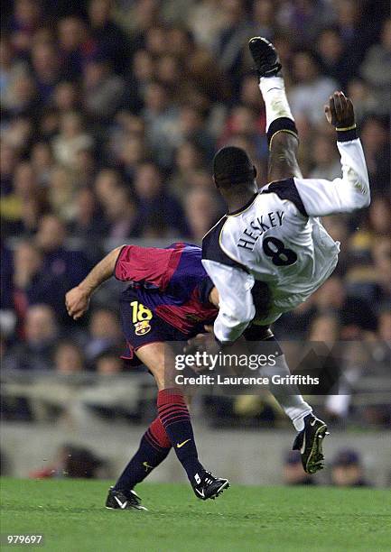 Emile Heskey of Liverpool and Garcia Gabri of Barcelona in action during the UEFA Cup Semi Final First Leg match between Barcelona and Liverpool at...