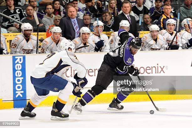 Wayne Simmonds of the Los Angeles Kings skates with the puck against Dan Hamhuis of the Nashville Predators on March 14, 2010 at Staples Center in...