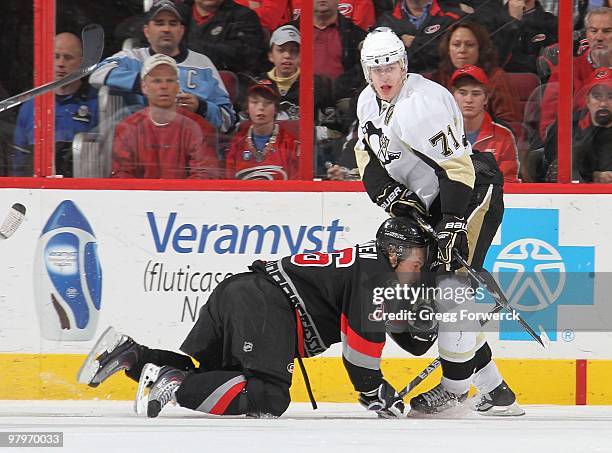 Jussi jokinen of the Carolina Hurricanes collides head first into Evgeni Malkin of the Pittsburgh Penguins during a NHL game on March 11, 2010 at RBC...