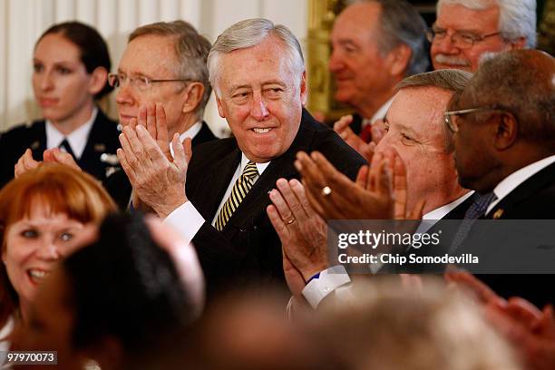 House Majority Leader Steny Hoyer applauds with fellow Democratic leaders during the signing ceremony for the Affordable Health Care for America Act...