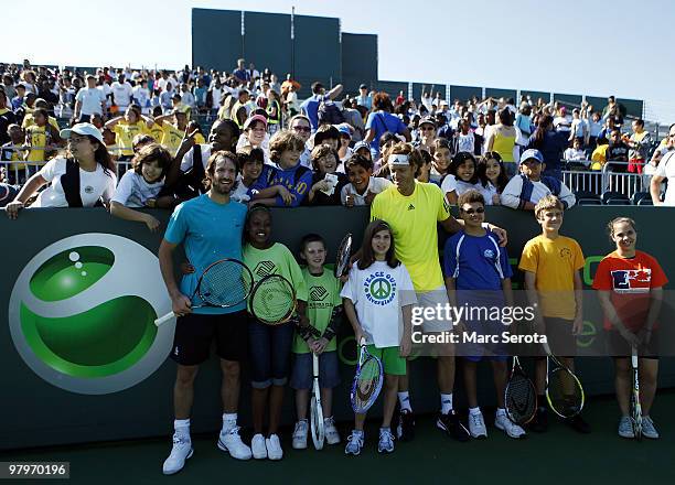 Tennis players Christopher Kas and Dick Norman pose for photos at Kids Day at Crandon Park Tennis Center during the Sony Ericsson Open on March 23,...