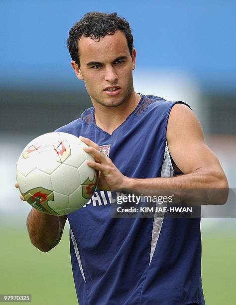 Landon Donovan, midfielder of the USA's soccer team helds the ball at Daejeon World Cup stadium in South Korea, 13 June 2002. The United States find...