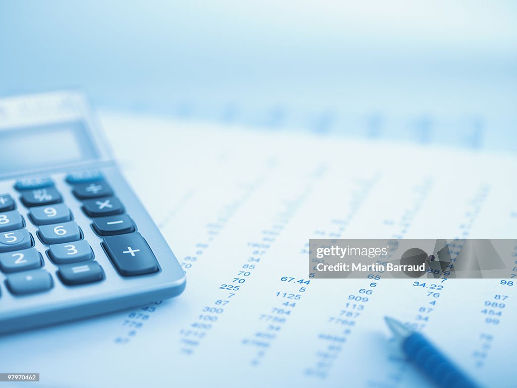 Close up of calculator and data