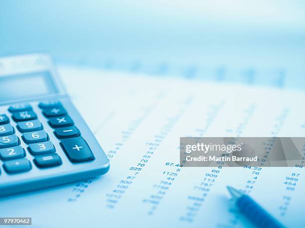 close up of calculator and data - finanzplanung stock-fotos und bilder