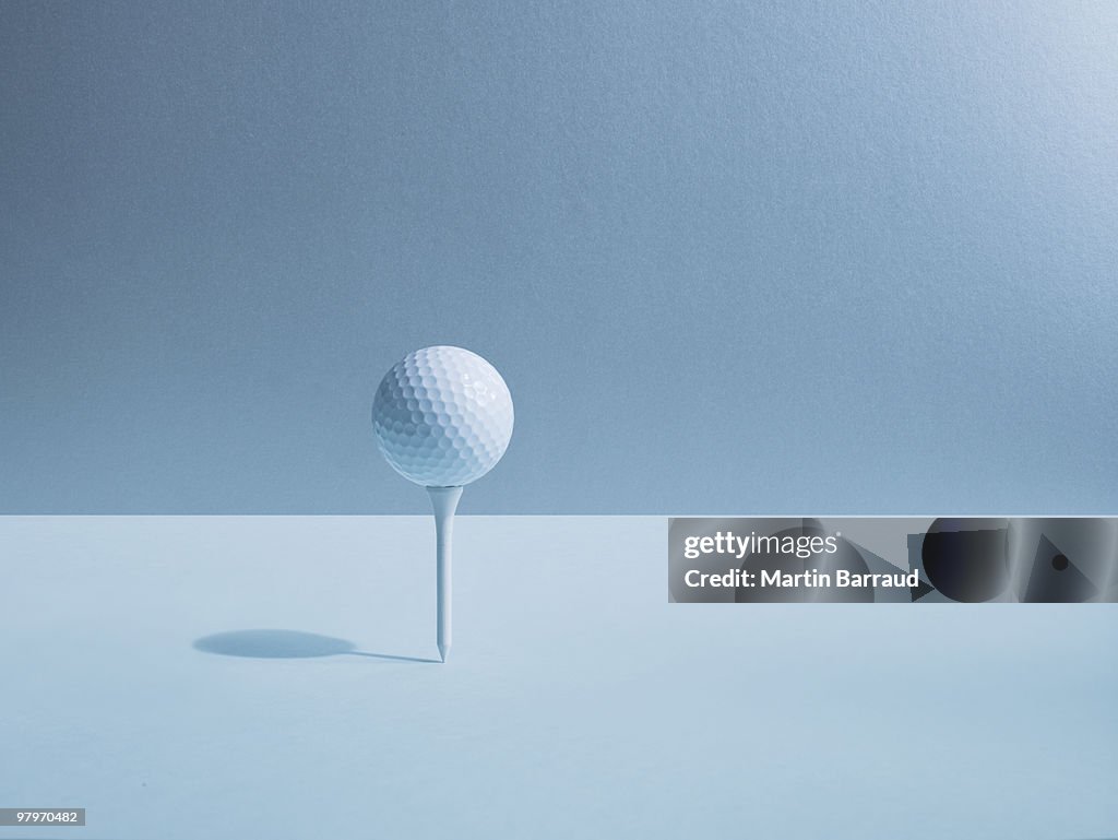 Golf ball balancing on tee
