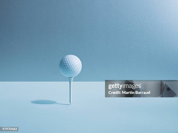golf ball balancing on tee - golfboll bildbanksfoton och bilder
