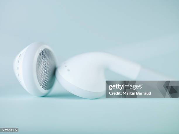 close up of headphones - in ear headphones photos et images de collection