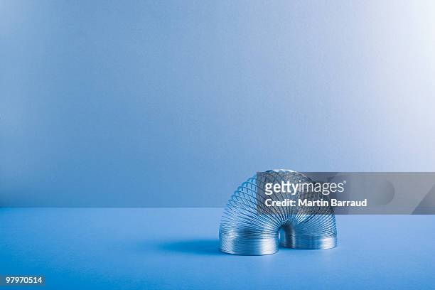 metal coil toy - elastic stock pictures, royalty-free photos & images
