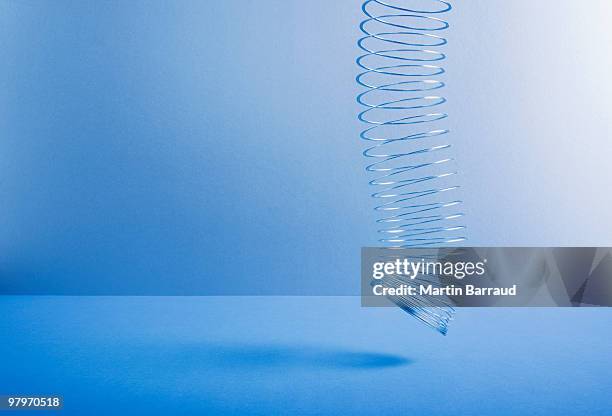metal coil toy dangling - step walker stock pictures, royalty-free photos & images