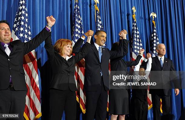 President Barack Obama celebrates with lawmakers after holding a rally celebrating the passage and signing into law of the Patient Protection and...