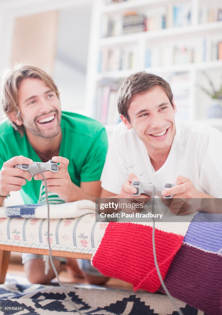 Men playing video game